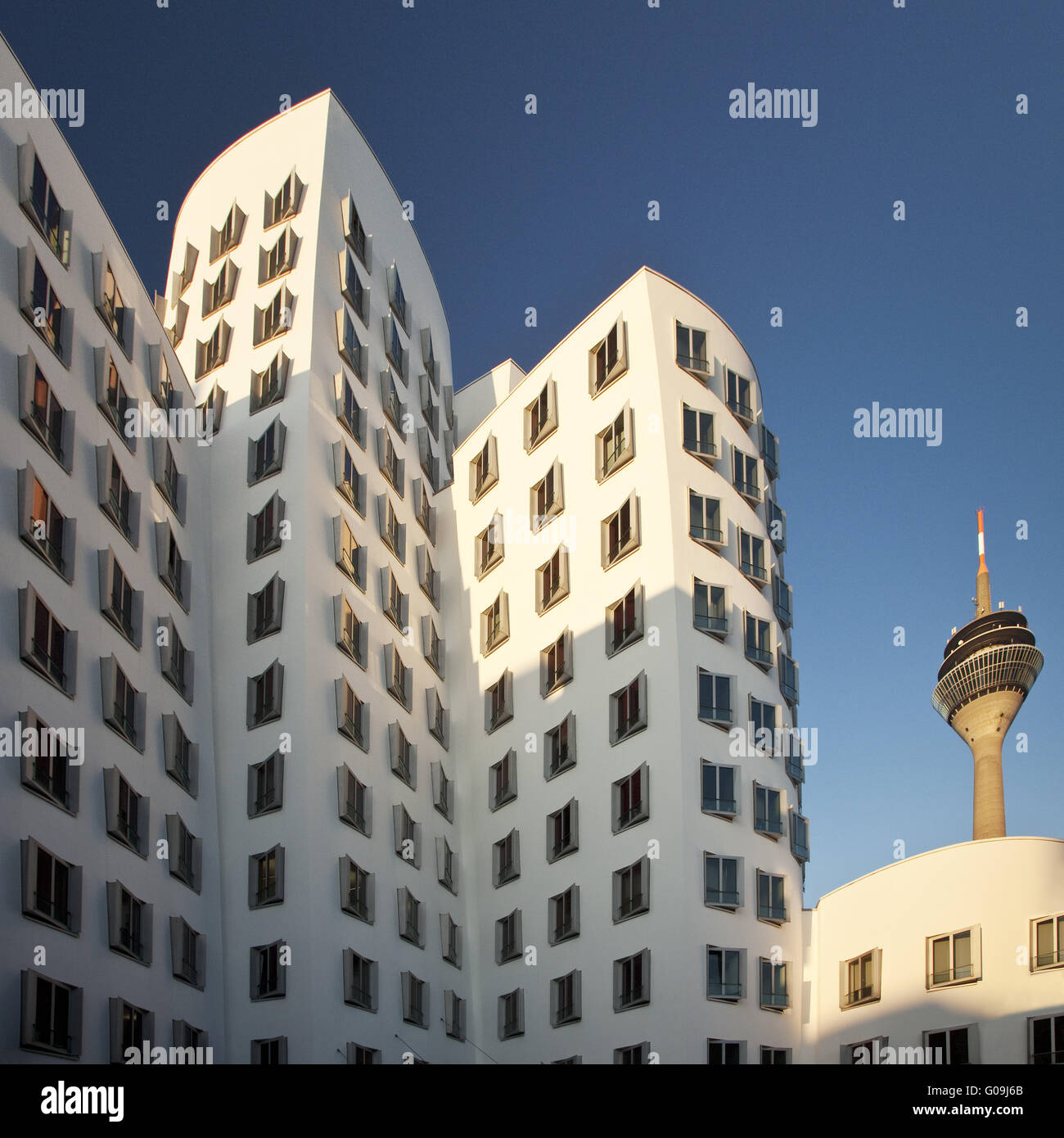 Gehry building with the Rhine Tower in Duesseldorf Stock Photo