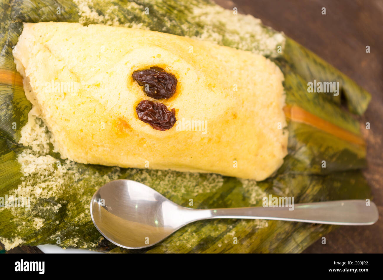 Delicious and traditional quimbolito, sweet cake with raisins on achira leaf Stock Photo
