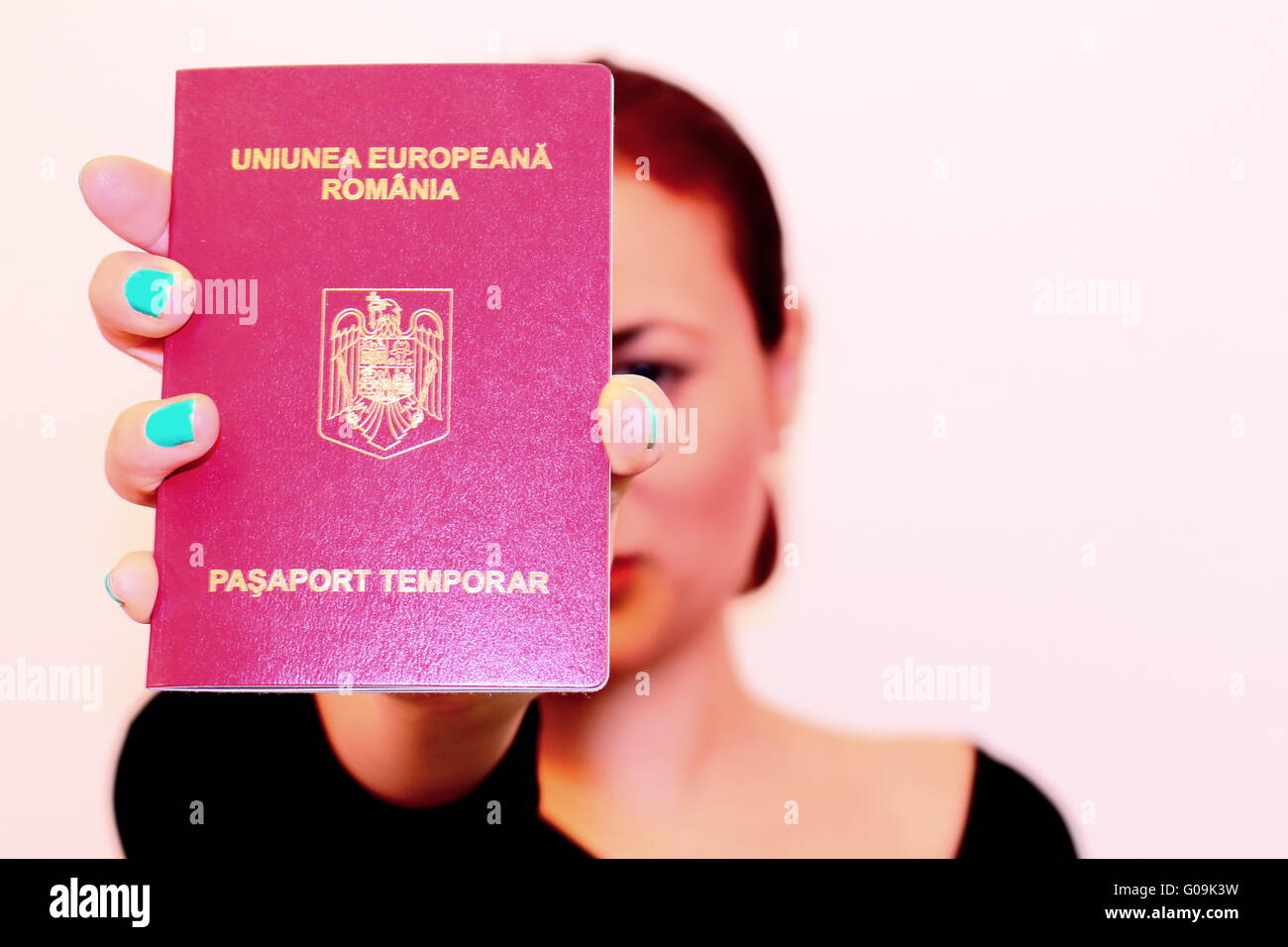Woman shows the new Romanian passport Stock Photo - Alamy