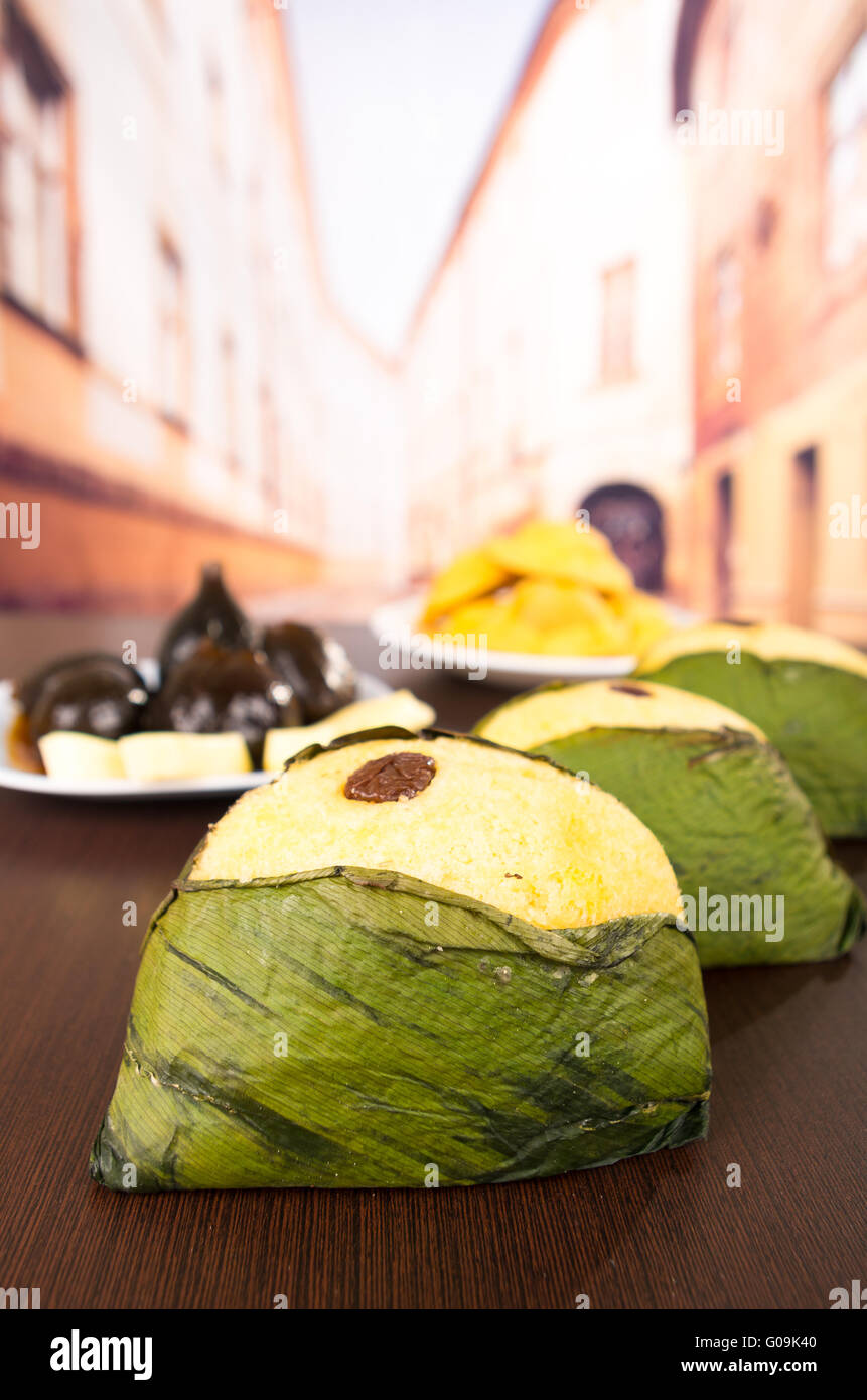 Delicious traditional sweet dessert wrapped on achira leaf Stock Photo
