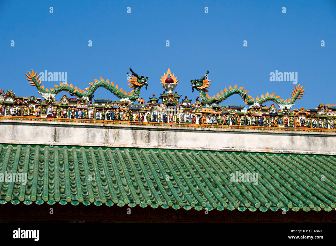 The carving of figurines on roof of Chinese temple Stock Photo