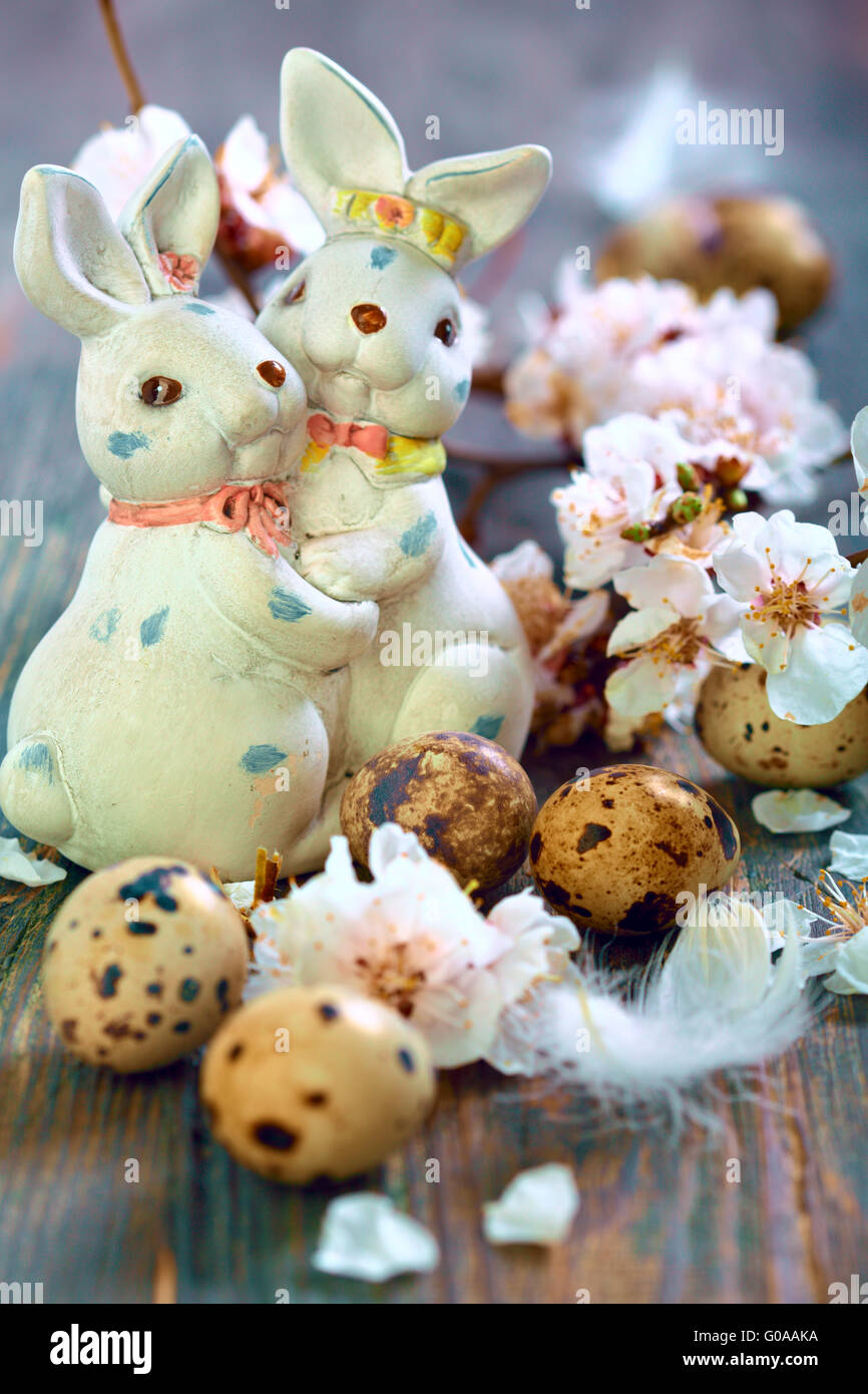 Easter bunnies and apricot flowering branches Stock Photo Alamy
