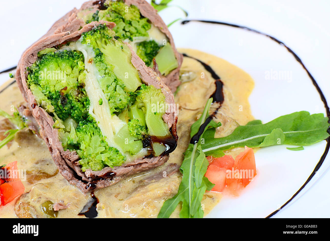 Timbale from beef from a broccoli, cheese and sauce from mushrooms