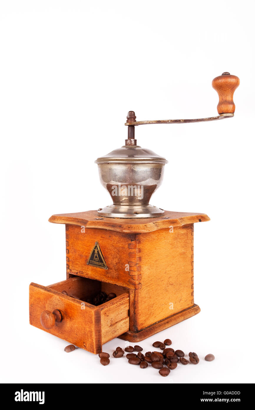 Old broken coffee mill on white background Stock Photo Alamy
