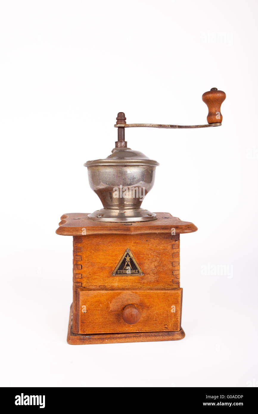 Old broken coffee mill on white background Stock Photo Alamy
