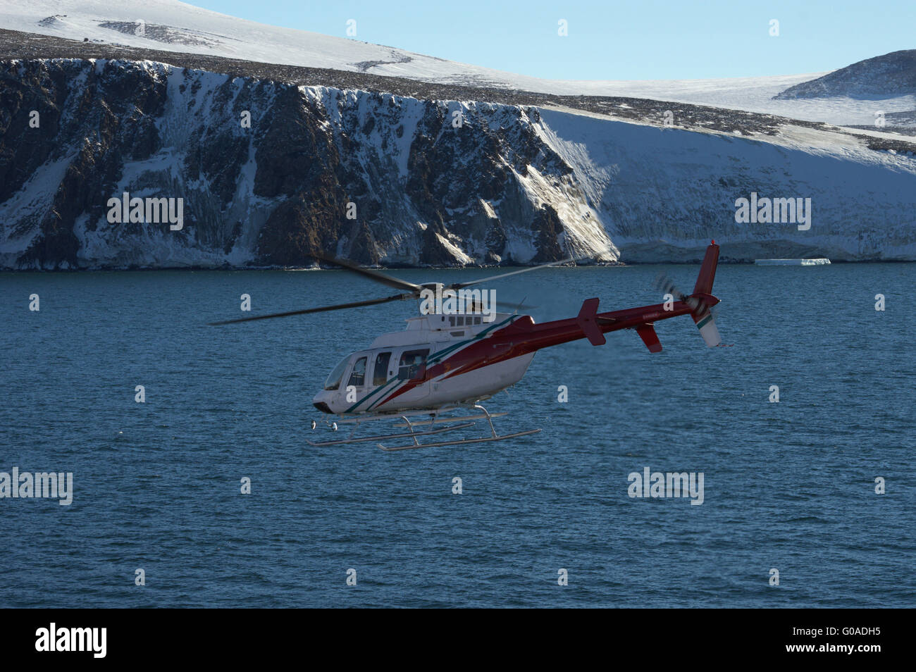 helicopter in the sea of antarctic Stock Photo