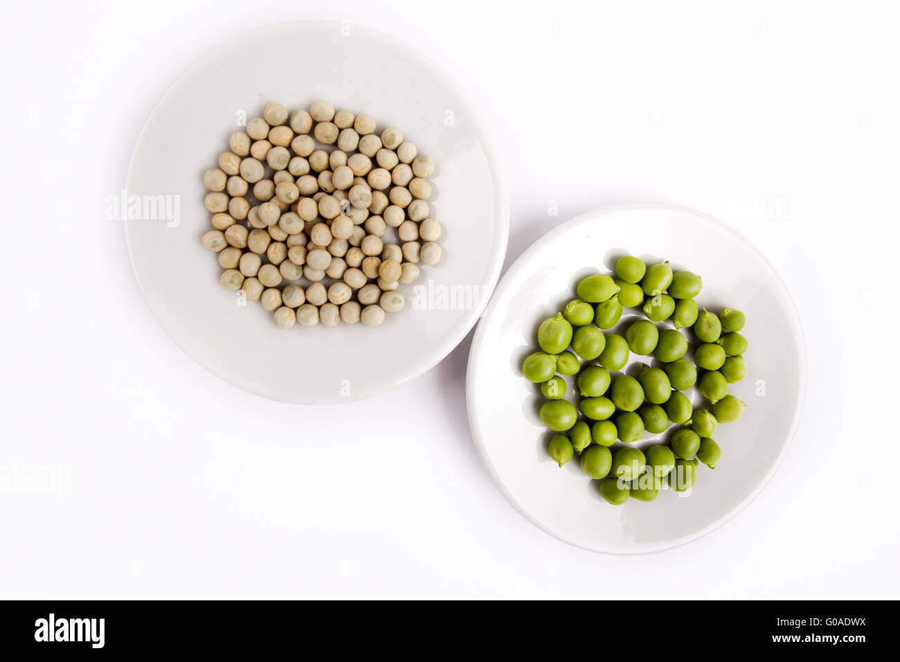 Fresh and dried Peas on white Background Stock Photo