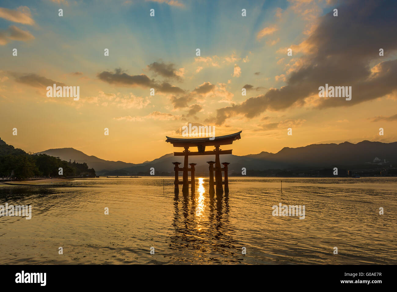 Sunset at the famous floating torii gate of the Itsukushima Shrine on Miyajima at high tide Stock Photo