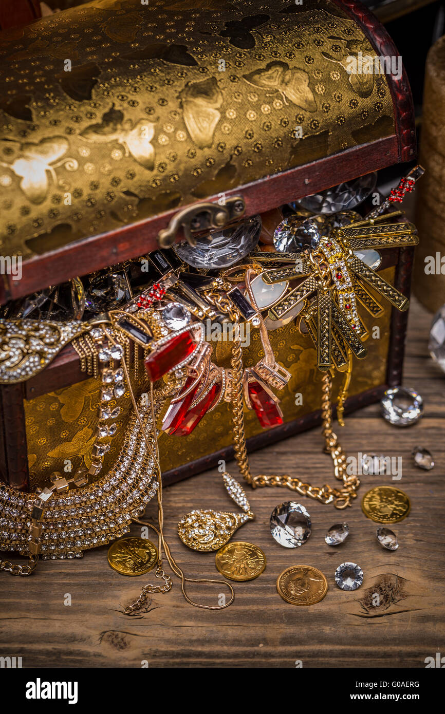 Open treasure chest full of jewellery Stock Photo