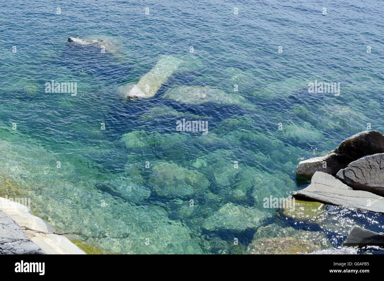 Rock under clear water Stock Photo