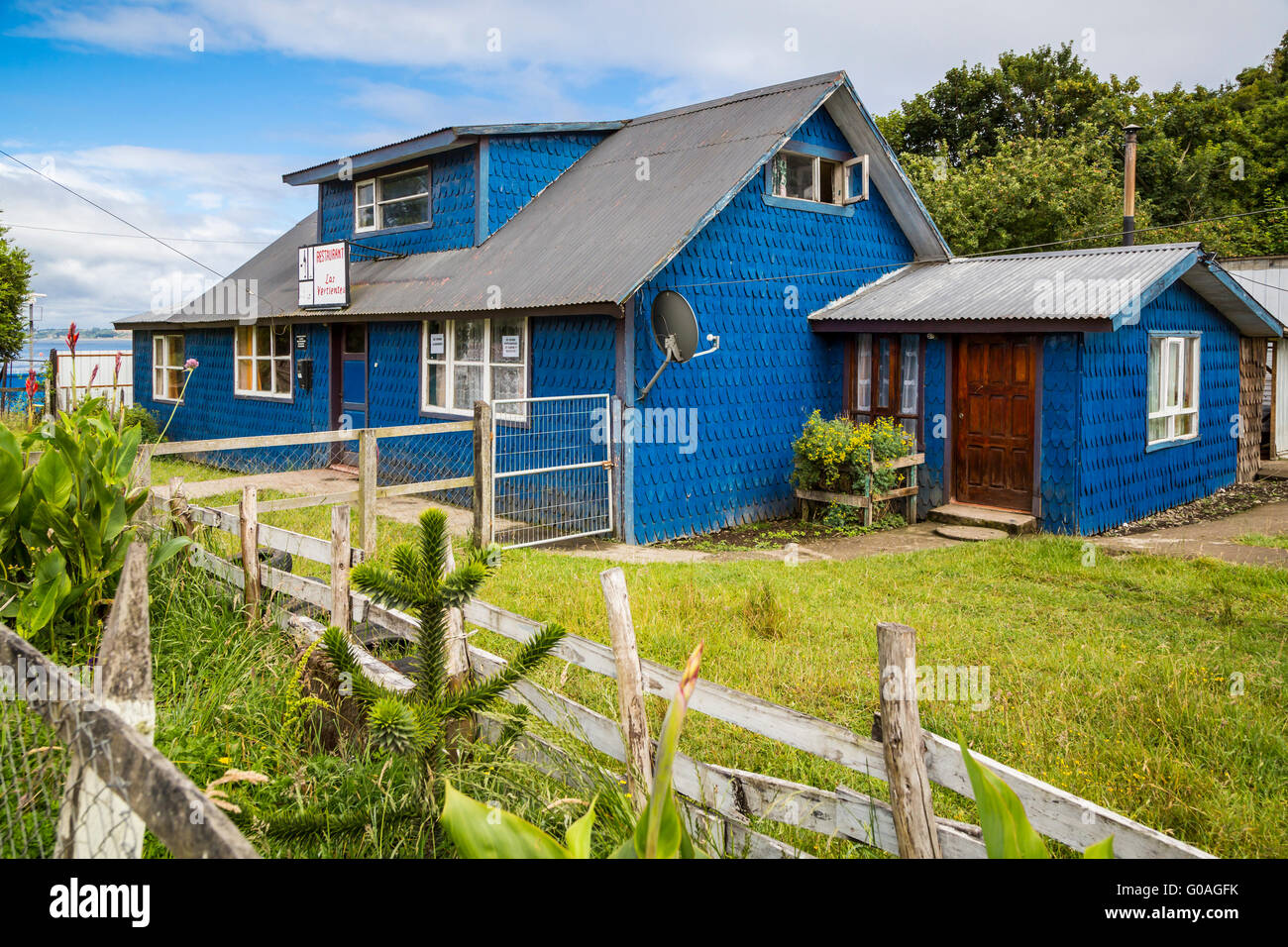 A blue house in the village of Achao, Chile, South America. Stock Photo