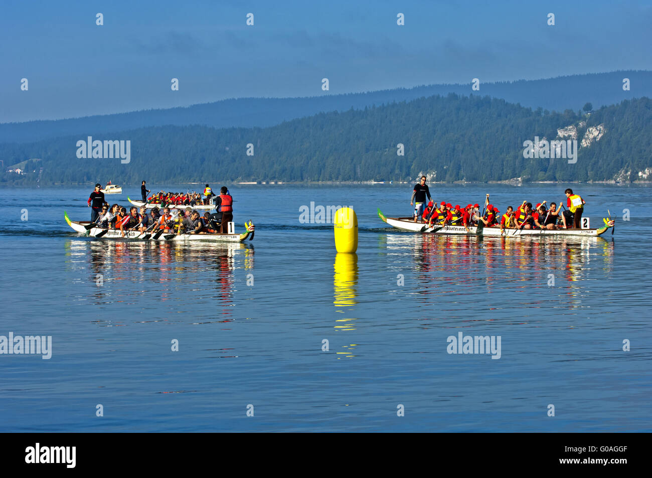 Dragon boats on lake Lac de Joux,Switzerland Stock Photo