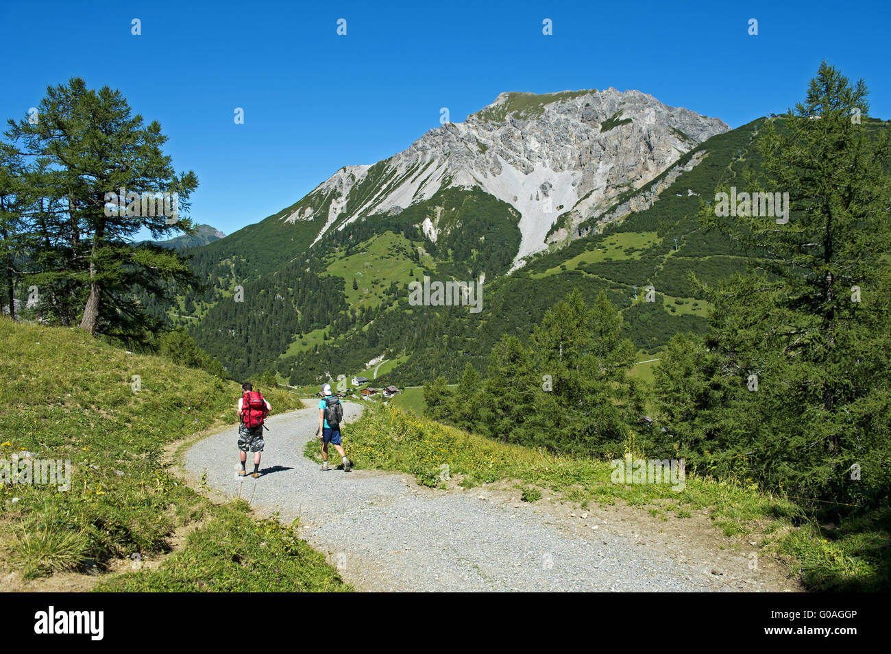 Hikers on a trail in the hiking area Malbun,Liech Stock Photo