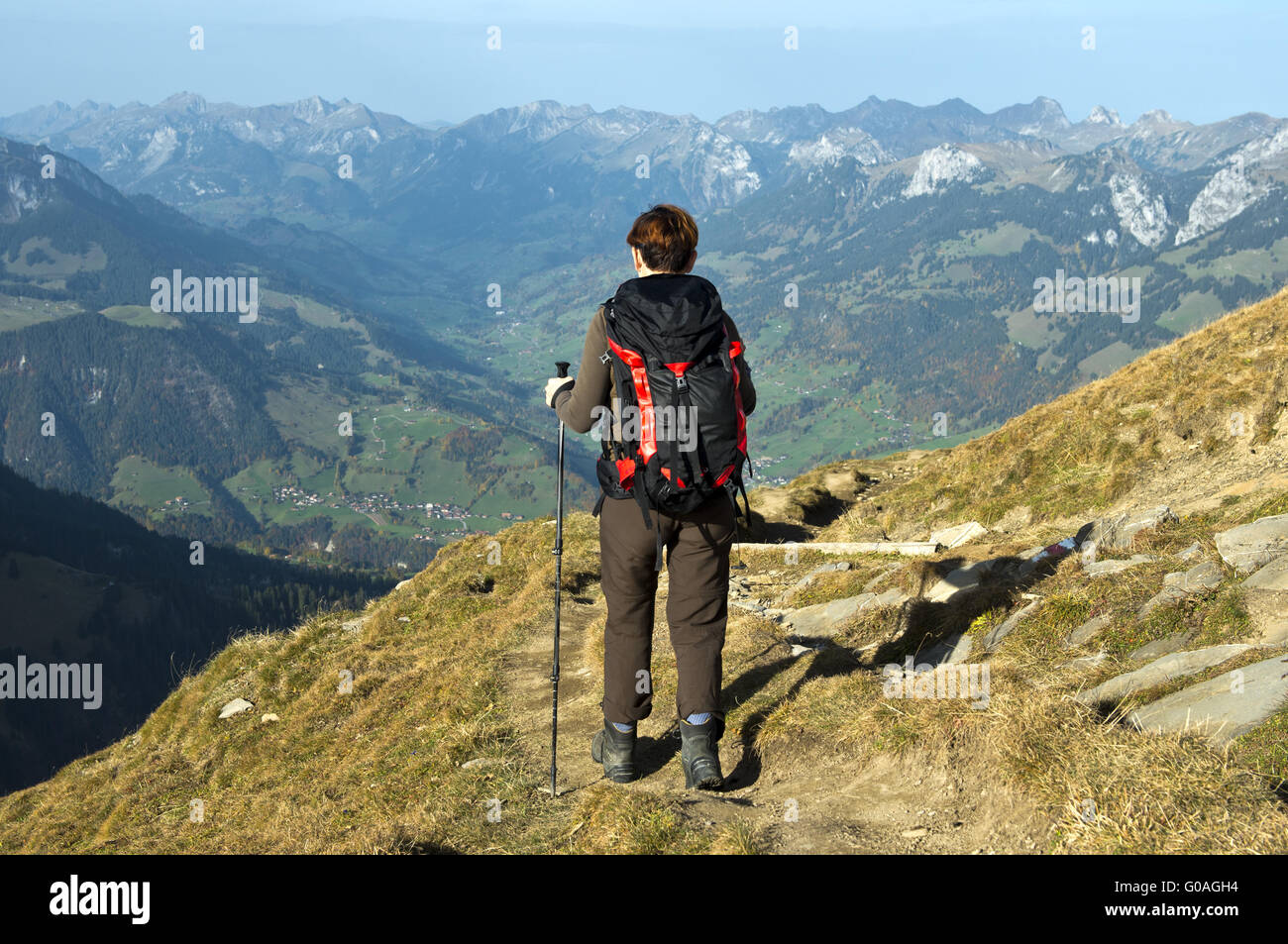 Hiker on the descent from Mt Niesen,Switzerland Stock Photo