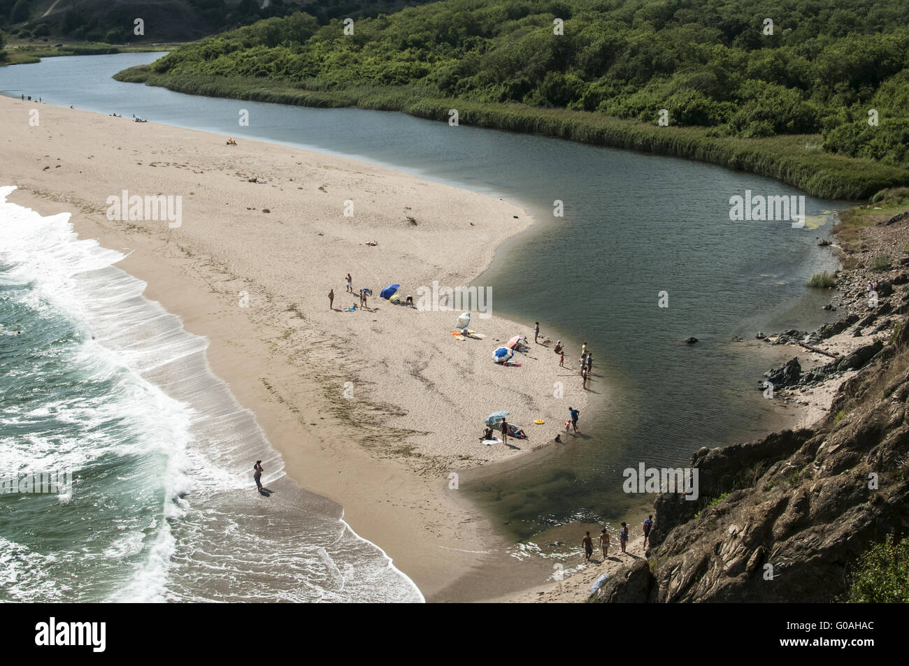 Mouth of the river flows into sea at sand beach la Stock Photo - Alamy
