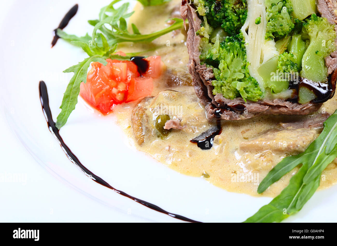 Timbale from beef from a broccoli, cheese and sauce from mushrooms