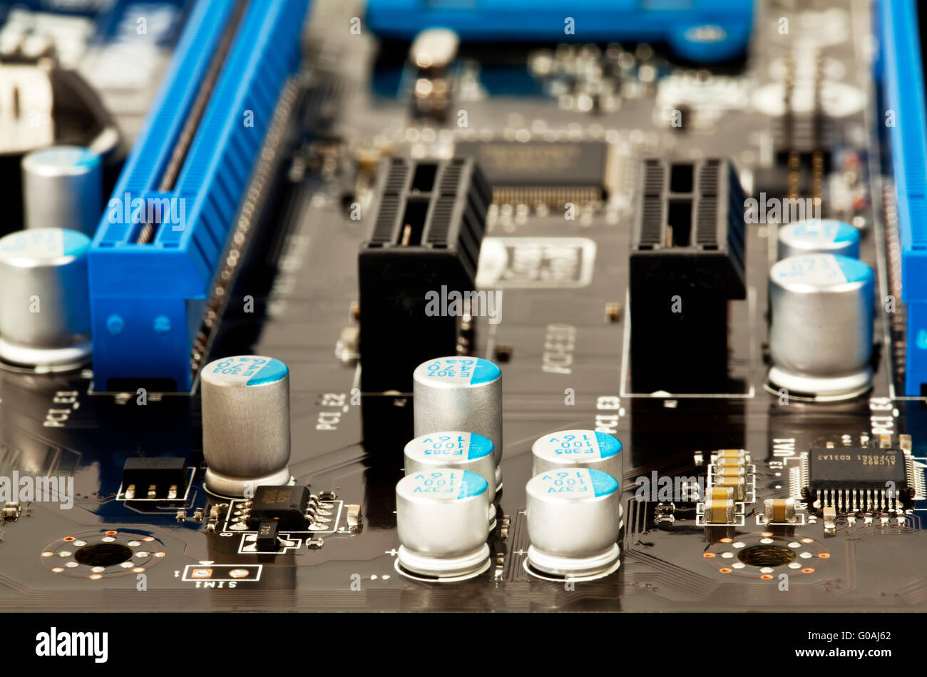 Condensators on laptop motherboard close view Stock Photo