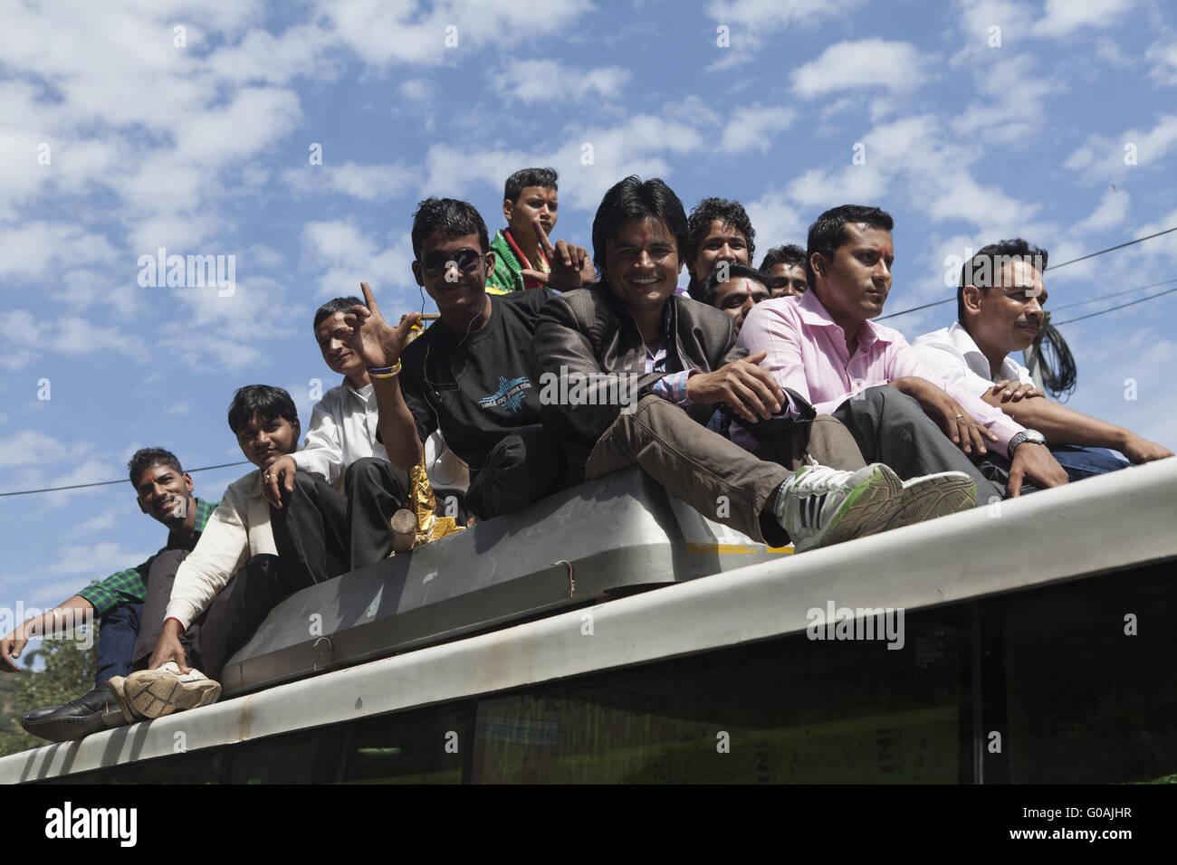 Indian people on a bus roof hi-res stock photography and images - Alamy