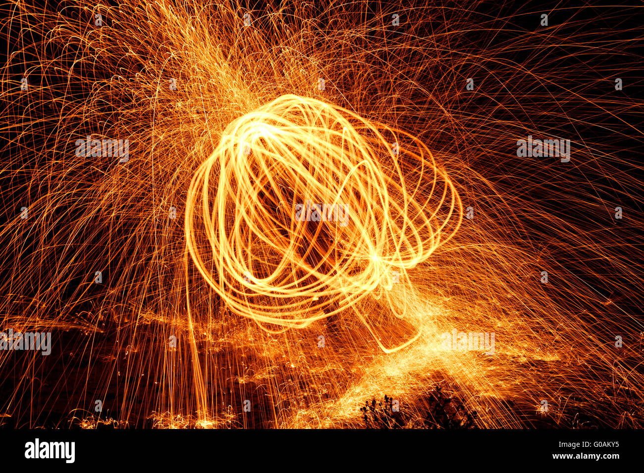 Showers of hot glowing sparks from spinning steel wool Stock Photo Alamy
