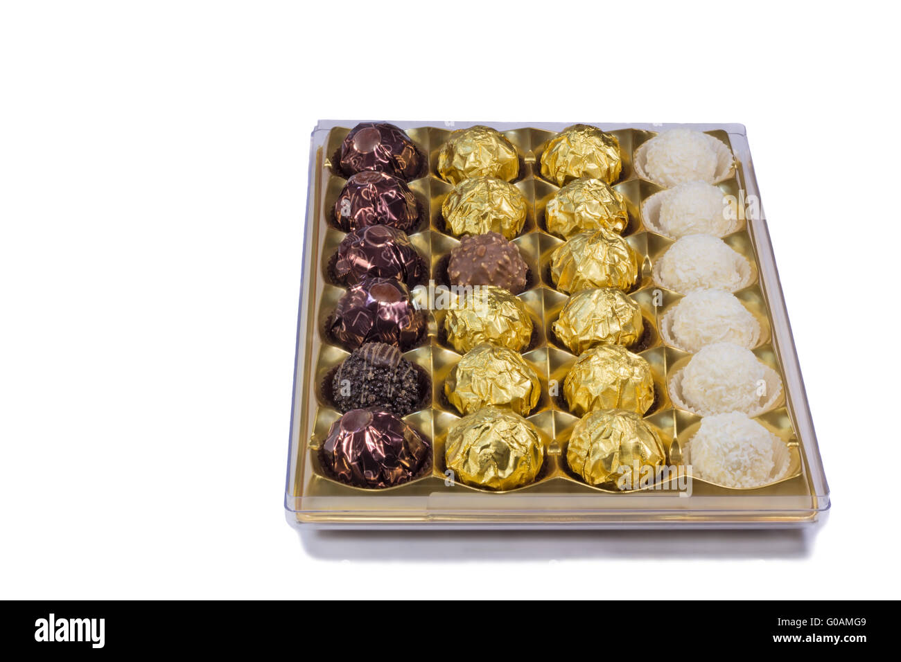 Chocolate sweets in the box on the white backgroun Stock Photo