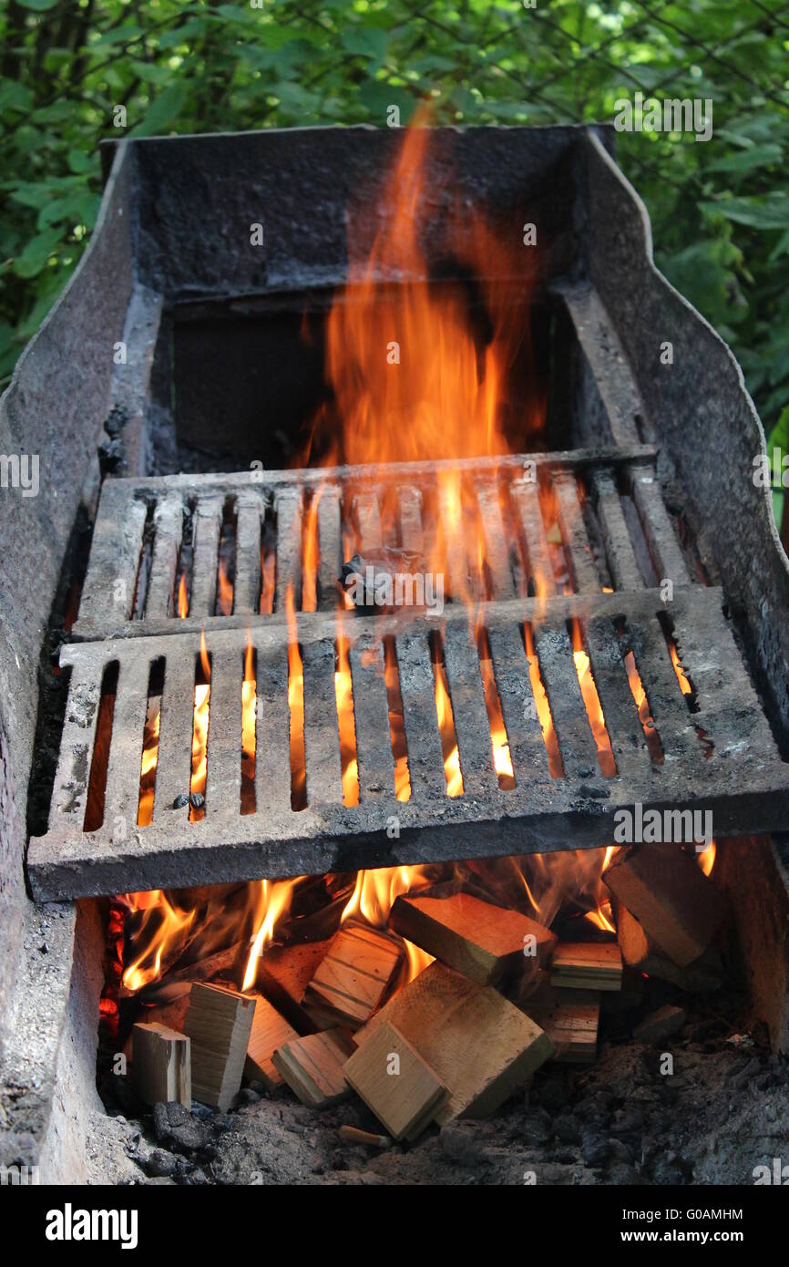 big brazier with burning fire prepared for cooking Stock Photo Alamy