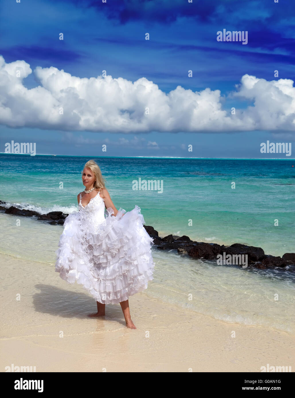 woman in a dress of the bride standing at sea edge Stock Photo - Alamy
