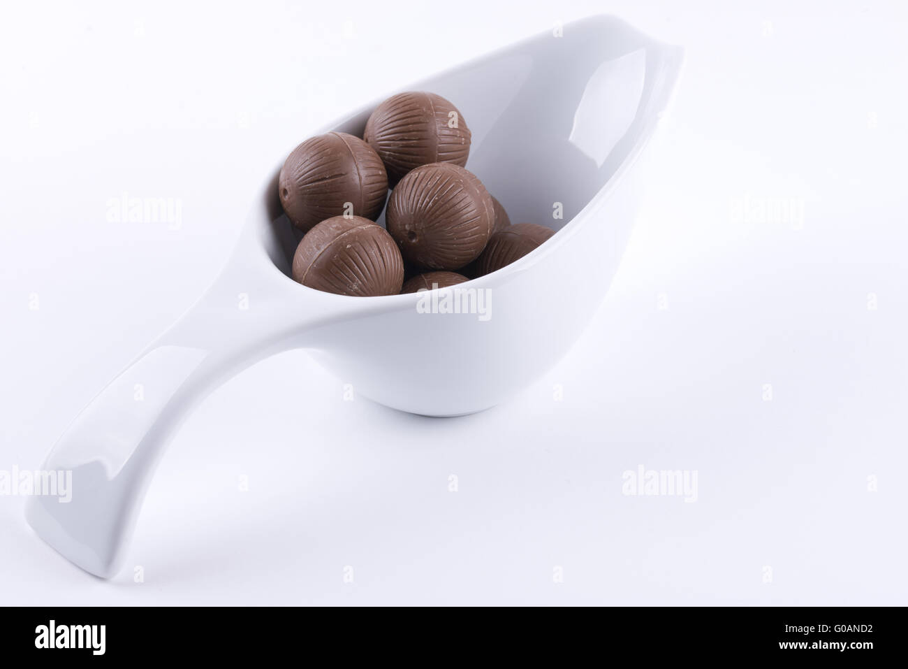 Chocolate balls in a white bowl Stock Photo