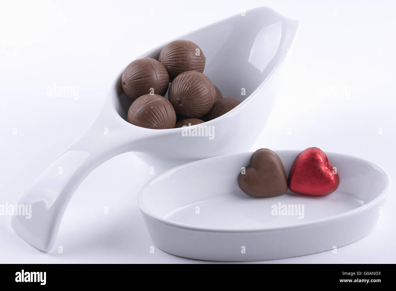 Chocolate balls and chocolate hearts Stock Photo