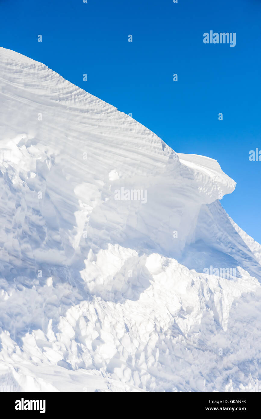 big snow hummock of pure white snow made wind Stock Photo