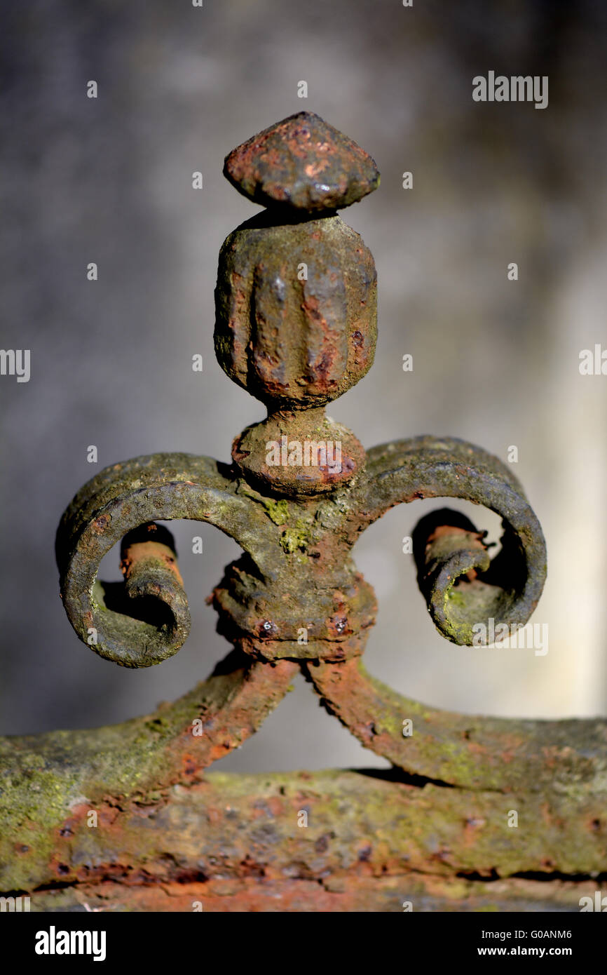 Rusted ornament of a cast-iron fence Stock Photo