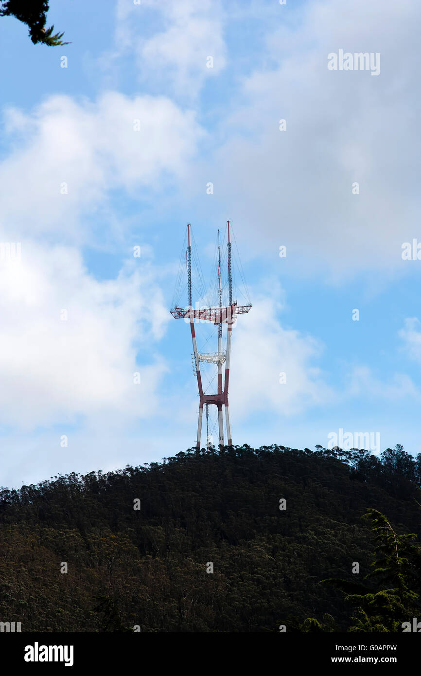 Top of Sutro Tower Above Hill Blue sky Stock Photo