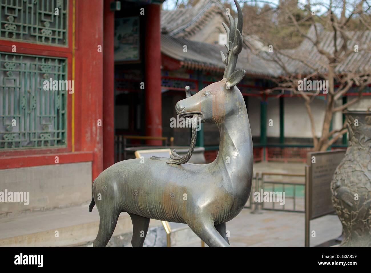 A Statue Of A Qilin Standing Before The Summer Pal Stock Photo