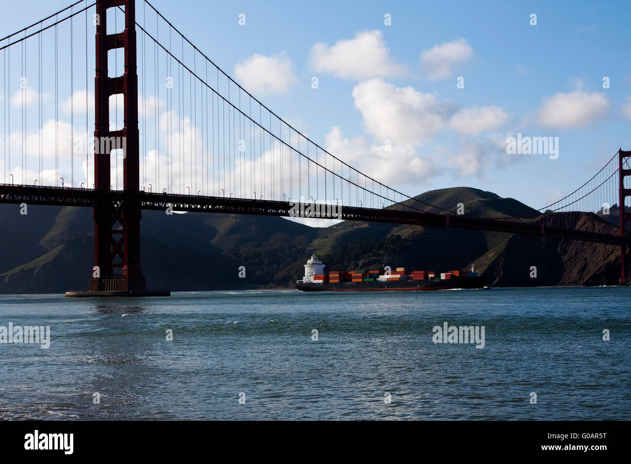 Container Ship Entering San Francisco Bay Under Bridge Stock Photo