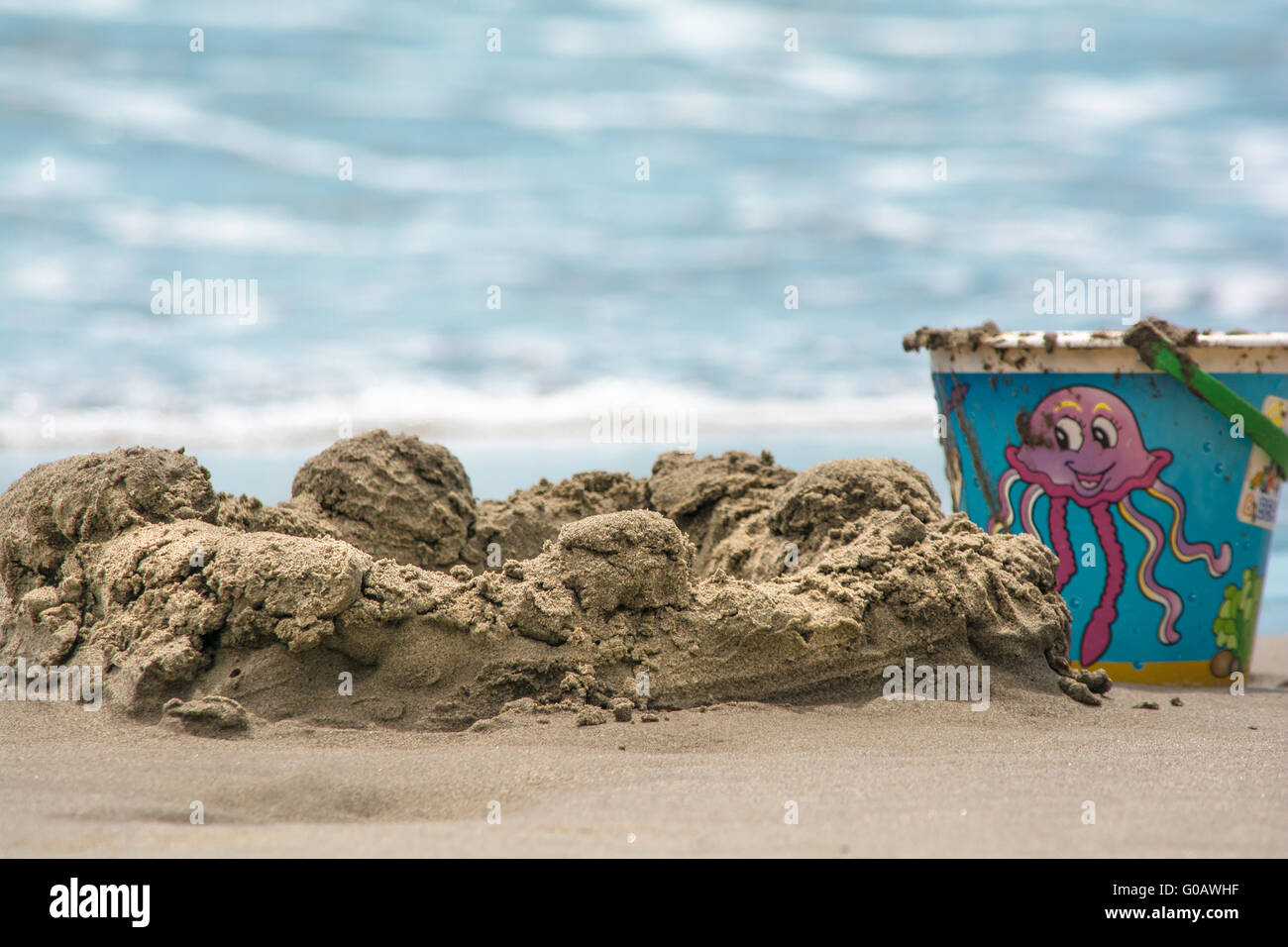 Bucket on the beach Stock Photo Alamy