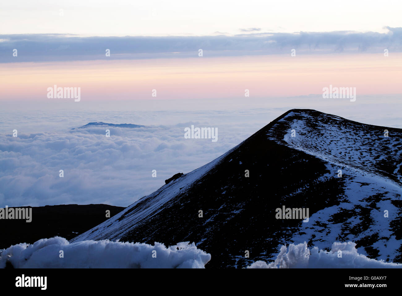 Hawaii Volcano cone ridge with clouds and snow Stock Photo Alamy