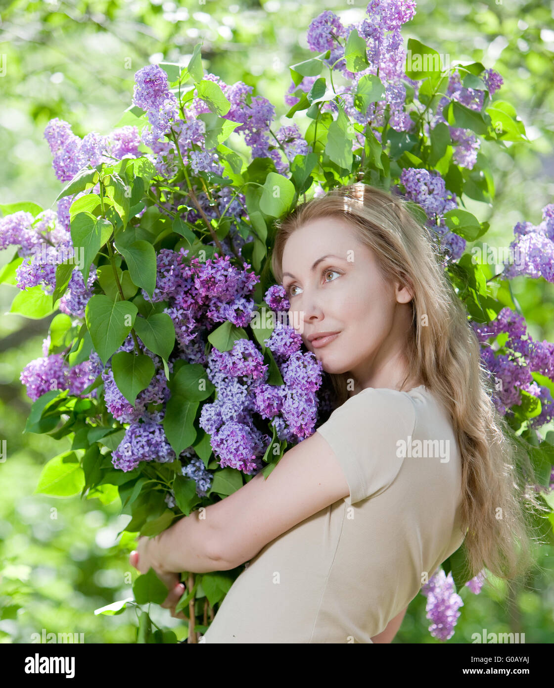 young woman in park with a big bouquet of a lilac Stock Photo - Alamy