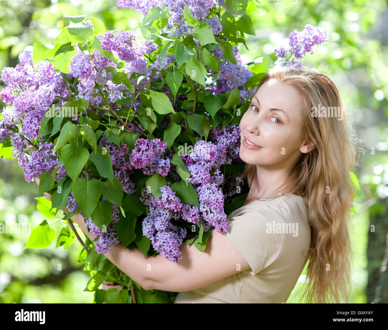 young woman in park with a big bouquet of a lilac Stock Photo - Alamy