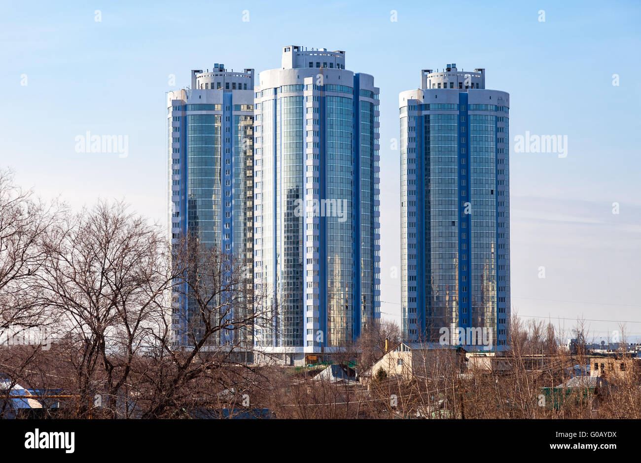 New tall modern apartment buildings against blue sky background Stock ...