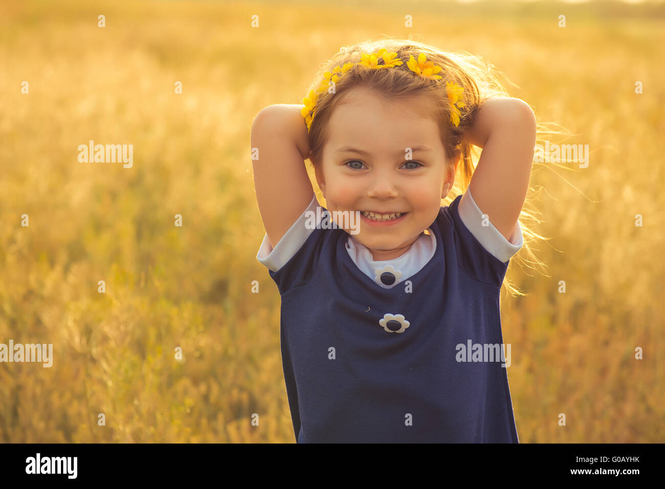 the beautiful little girl in a blue dress against Stock Photo - Alamy