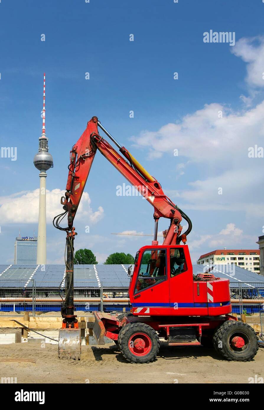 Red excavator in the castle(lock) Berlin with tele Stock Photo