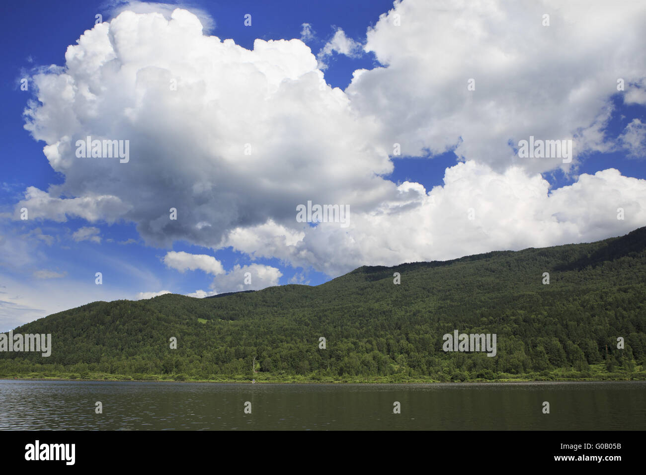 Beautiful clouds over mountain lake Manzherok. Stock Photo