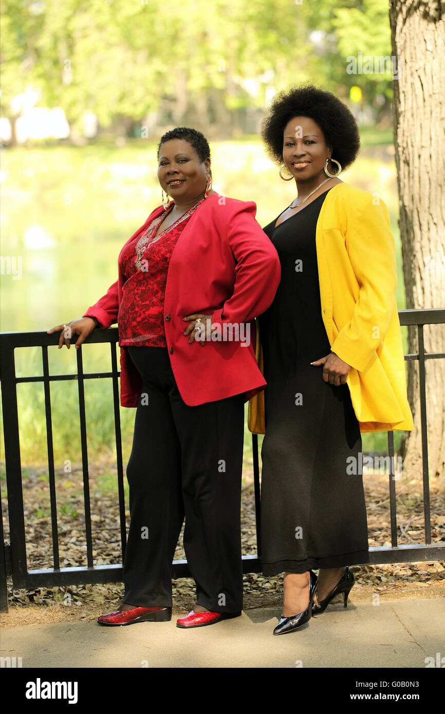 Two women standing together hi-res stock photography and images - Alamy