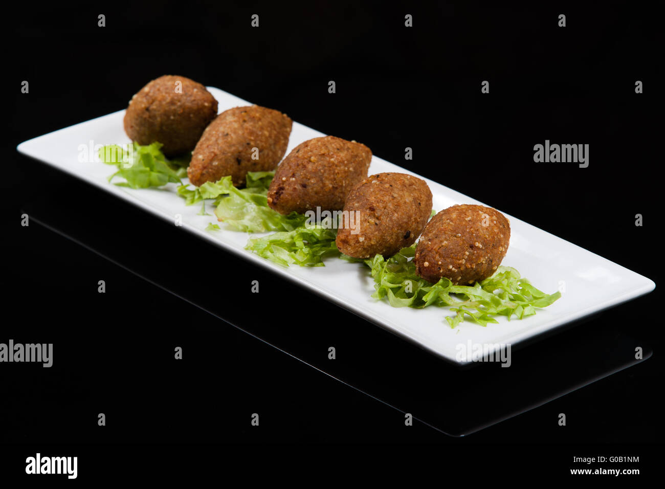 Kebbeh, ground red meat with crushed wheat, Lebanese cuisine. Stock Photo