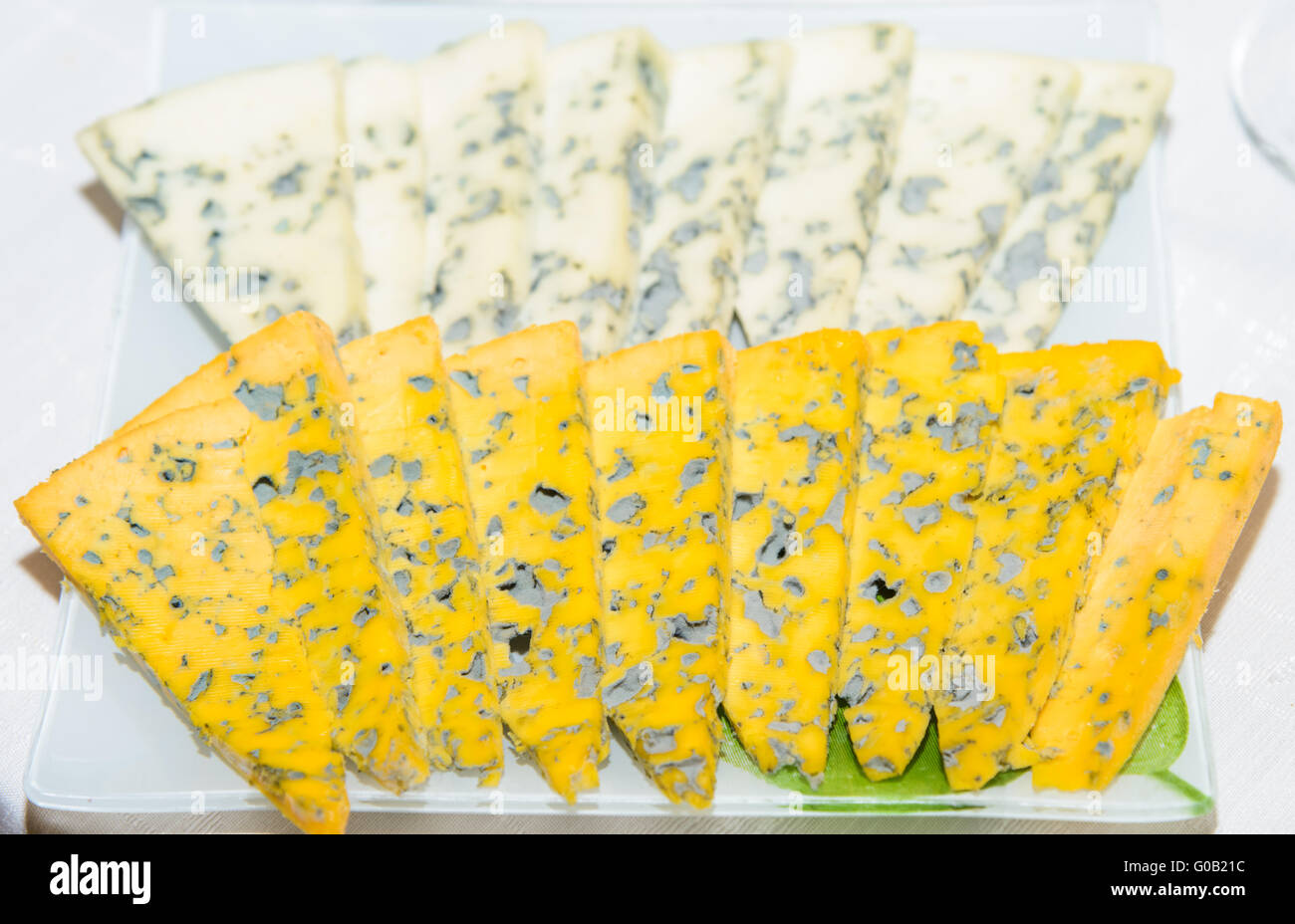 Segment from the yellow Cheese isolated on the white Stock Photo