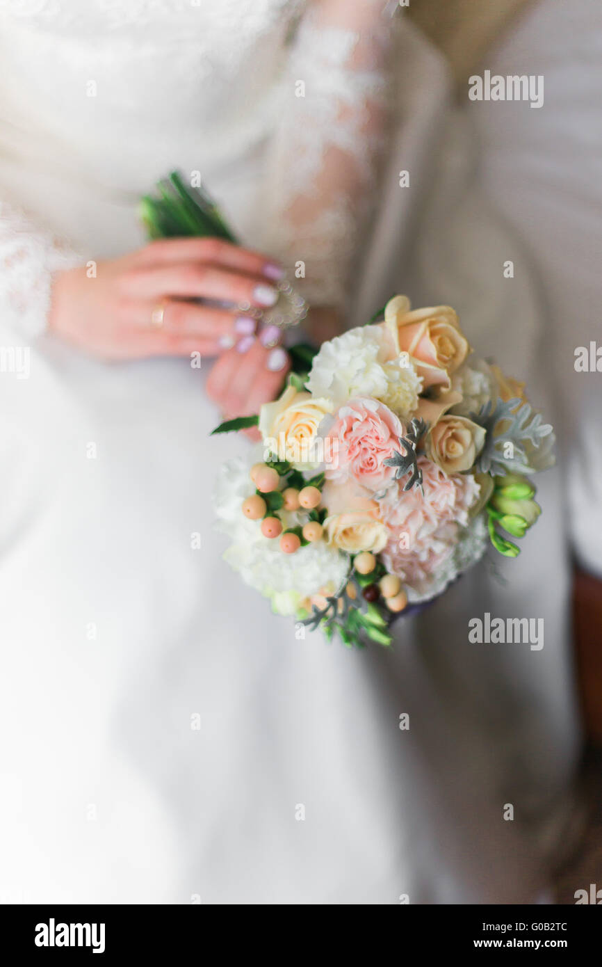 Pink and white wedding bouquet of roses in the hands Stock Photo - Alamy