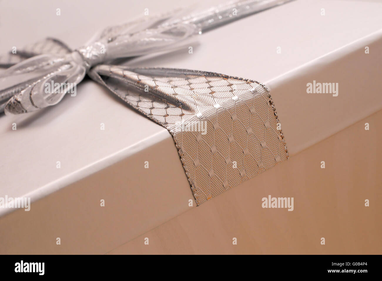 close-up picture of a grey presentbox with ribbon Stock Photo