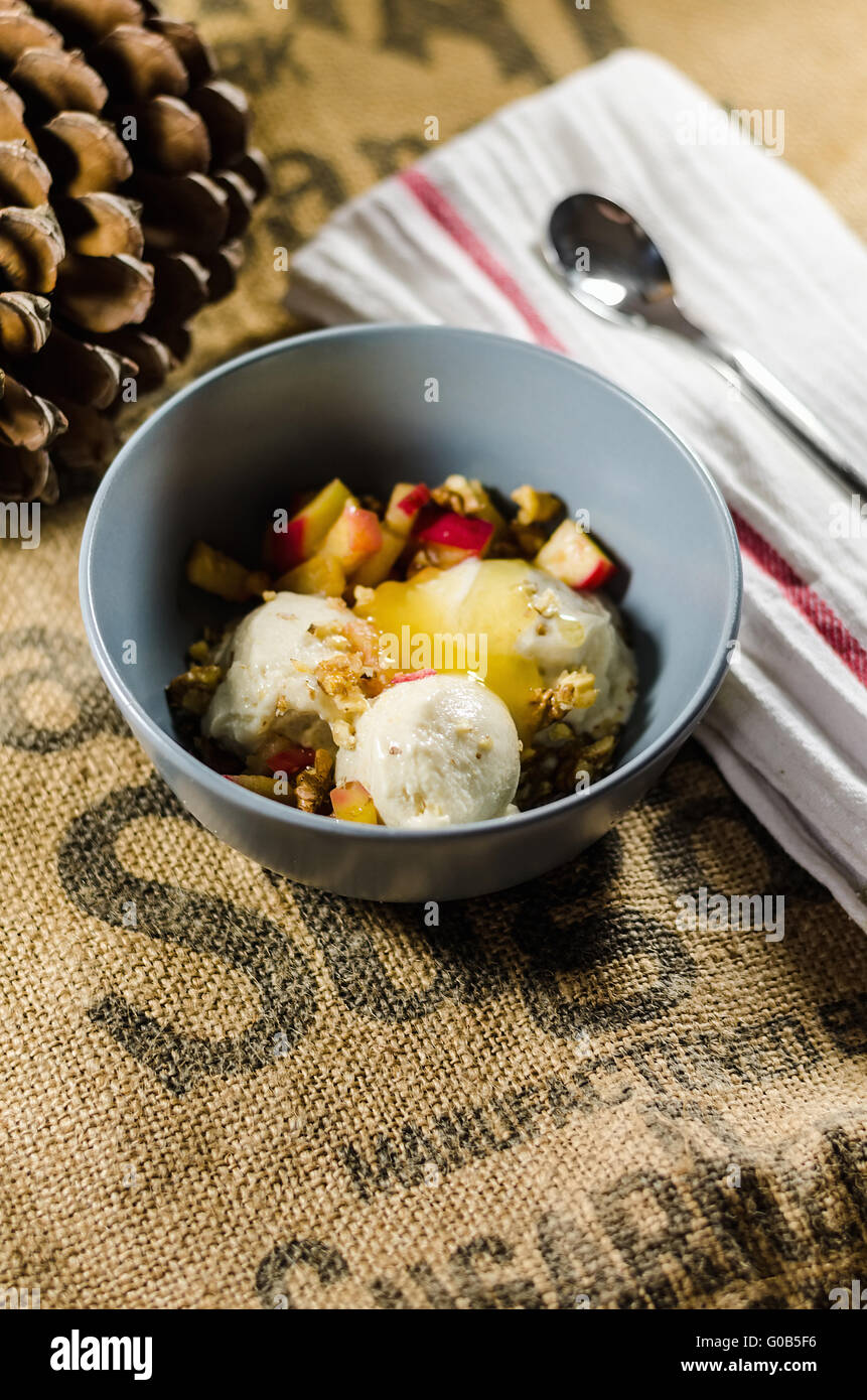 Yogurt; Cut Fruits; And Honey In Bowl By Napkin Stock Photo