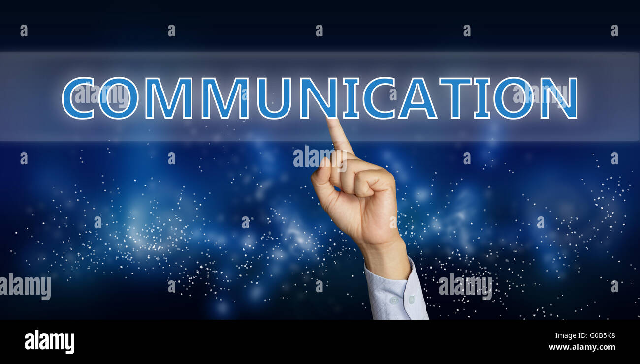 Education concept image of a businessman hand clicking Communication button on virtual screen over space background Stock Photo