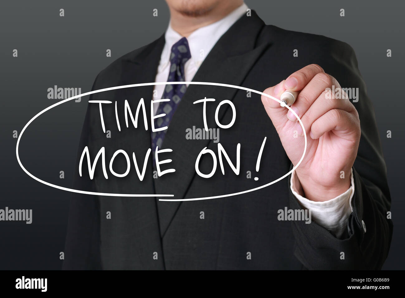 Business concept, image of a businessman holding marker and write Time To Move On words Stock Photo