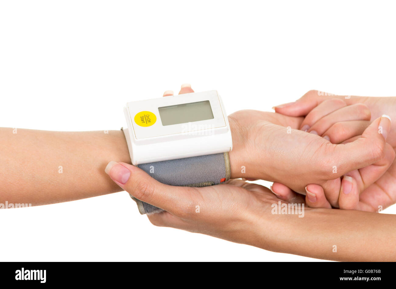 Patients arm with glucose measure meter around wrist and doctors hands holding supporting Stock